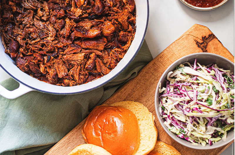 https://www.southernbride.com/wp-content/uploads/2020/08/Why-This-Range-Of-Cookware-By-Kana-Should-Be-On-Your-Registry-Pulled-Pork-Dutch-Oven-Table-Spread.jpg