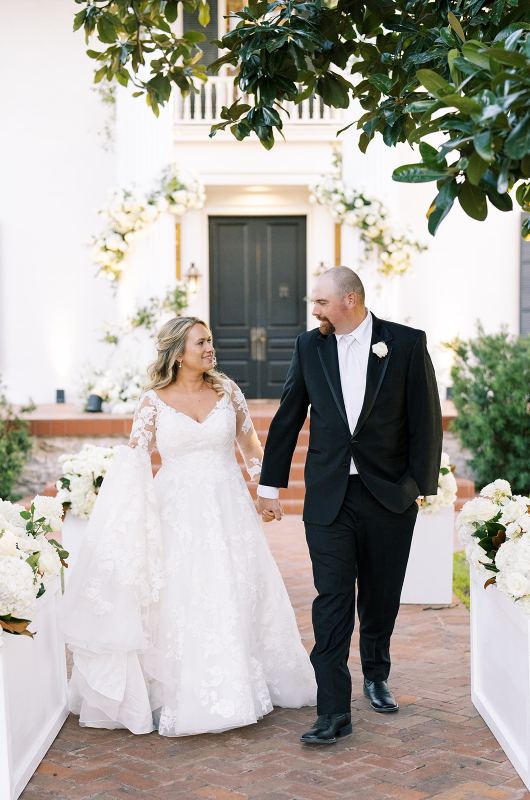 Jennifer Bremer And Dustin Owen Marry In Round Rock Texas walking hand in hand